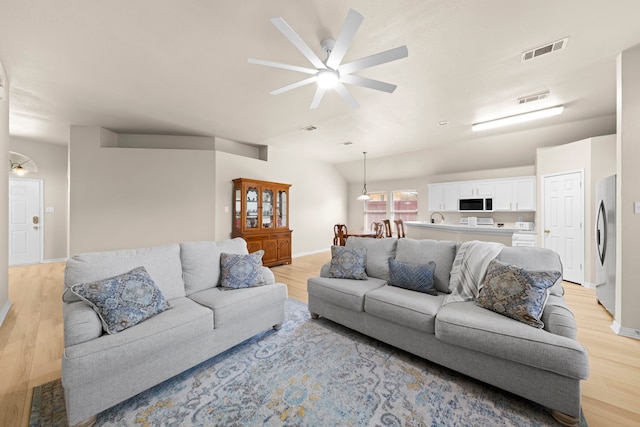 90 Elmwood Trl, Waxahachie, TX 75165 - living room with light wood-style flooring, a ceiling fan, and lofted ceiling