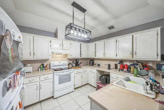 3612 Hummingbird Ave, Mcallen, TX 78504 - kitchen with white electric range oven, a textured ceiling, light countertops, under cabinet range hood, and light tile patterned floors