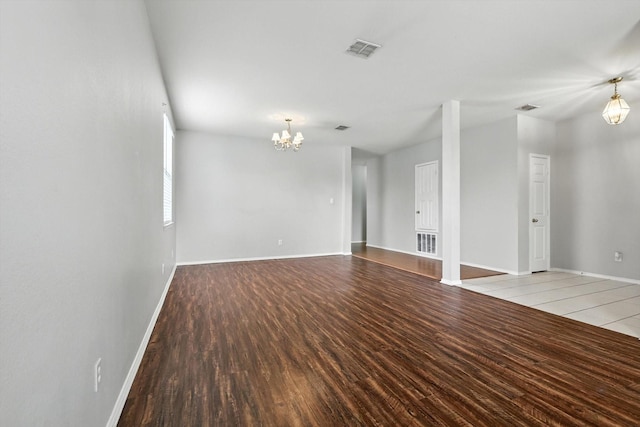 3136 Deleon Dr, Plano, TX 75025 - empty room featuring a chandelier and wood finished floors