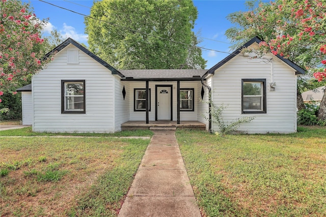 301 E Craven Ave, Lacy Lakeview, TX 76705 - bungalow-style house featuring covered porch, a front lawn, and roof with shingles