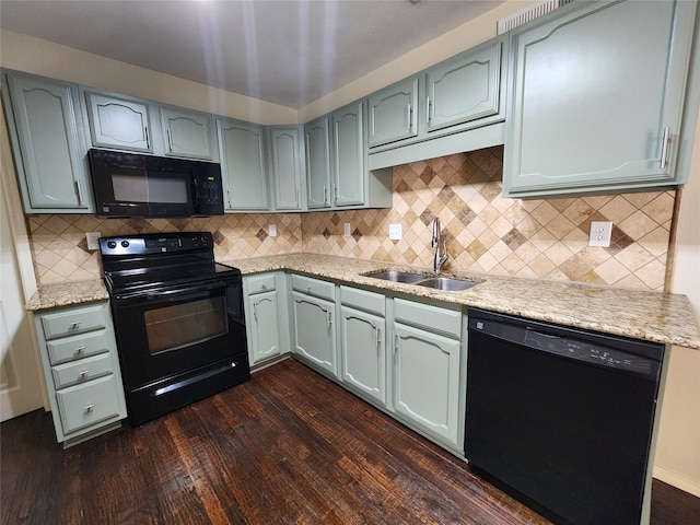 1408 Bandera Dr, Arlington, TX 76018 - kitchen featuring black appliances, dark wood finished floors, decorative backsplash, and light stone countertops