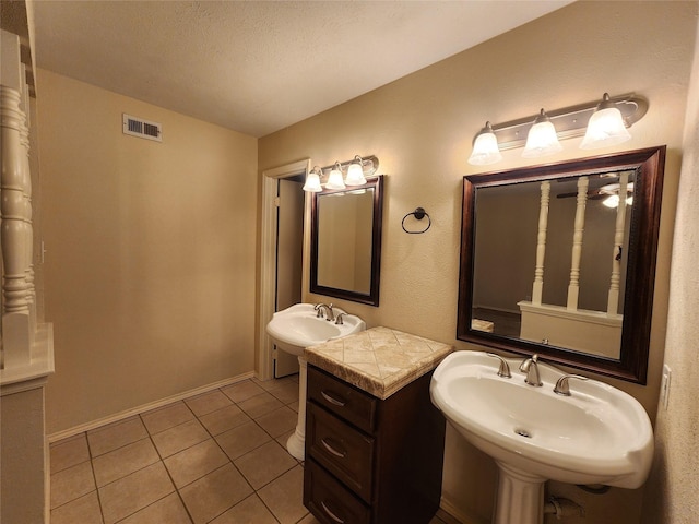 1408 Bandera Dr, Arlington, TX 76018 - bathroom with tile patterned flooring and a textured ceiling