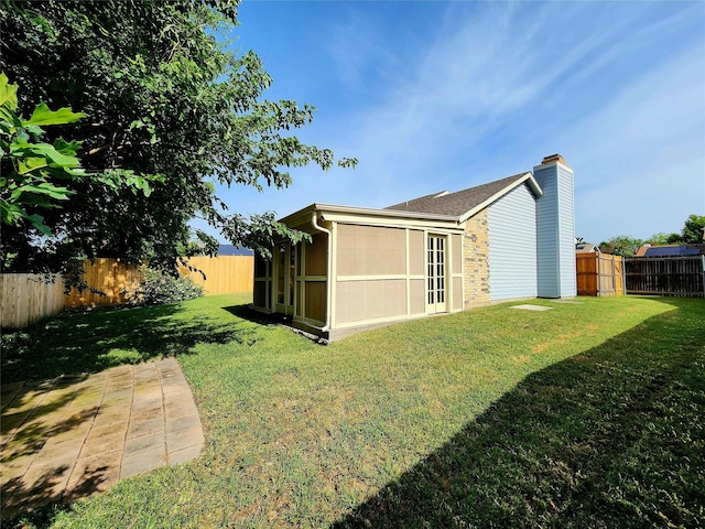 1408 Bandera Dr, Arlington, TX 76018 - rear view of house featuring a fenced backyard and a chimney