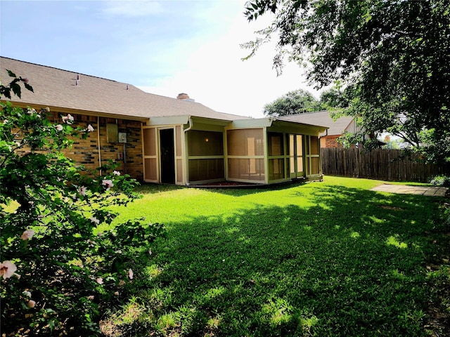 1408 Bandera Dr, Arlington, TX 76018 - rear view of property with a sunroom and a chimney