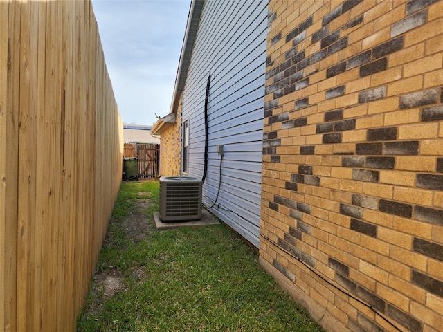1408 Bandera Dr, Arlington, TX 76018 - view of side of home with a central AC unit