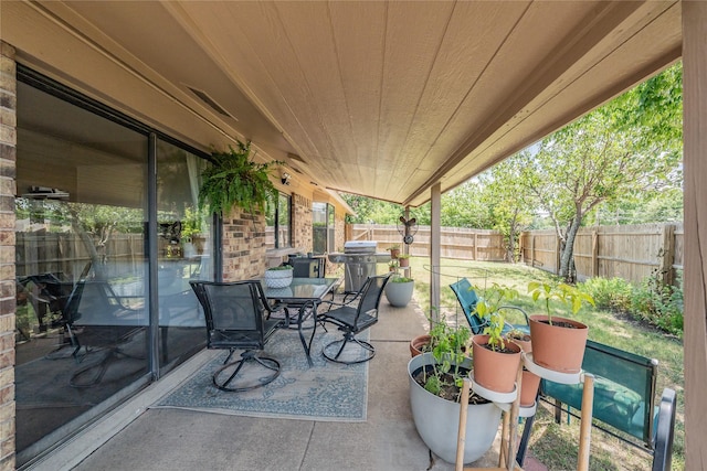 2416 Raintree Ct, Plano, TX 75074 - fenced backyard featuring a patio, a grill, and outdoor dining space