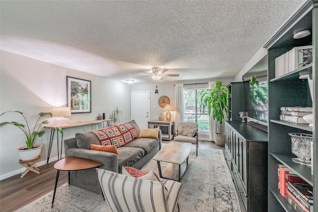 2416 Raintree Ct, Plano, TX 75074 - living room featuring wood finished floors, a textured ceiling, and ceiling fan
