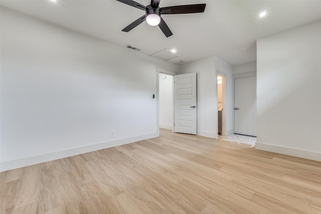 2504 Wicker Ave, Farmers Branch, TX 75234 - empty room with light wood-style flooring, ceiling fan, and attic access
