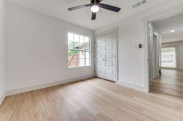 2504 Wicker Ave, Farmers Branch, TX 75234 - unfurnished bedroom with wood finished floors, ceiling fan, and a closet