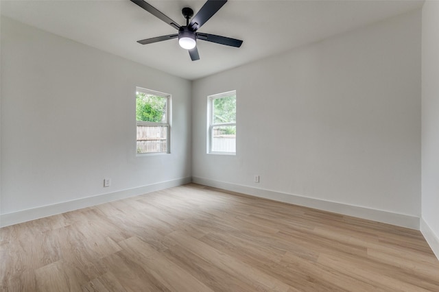 2504 Wicker Ave, Farmers Branch, TX 75234 - empty room with light wood finished floors and ceiling fan