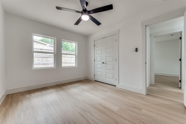 2504 Wicker Ave, Farmers Branch, TX 75234 - unfurnished bedroom featuring light wood-style floors, a closet, and a ceiling fan