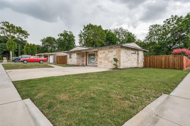 2504 Wicker Ave, Farmers Branch, TX 75234 - view of front facade featuring stone siding and driveway
