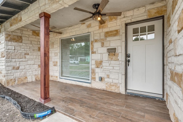 2504 Wicker Ave, Farmers Branch, TX 75234 - doorway to property featuring stone siding and a ceiling fan