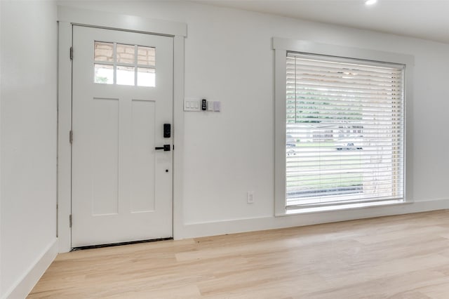 2504 Wicker Ave, Farmers Branch, TX 75234 - entryway featuring light wood finished floors