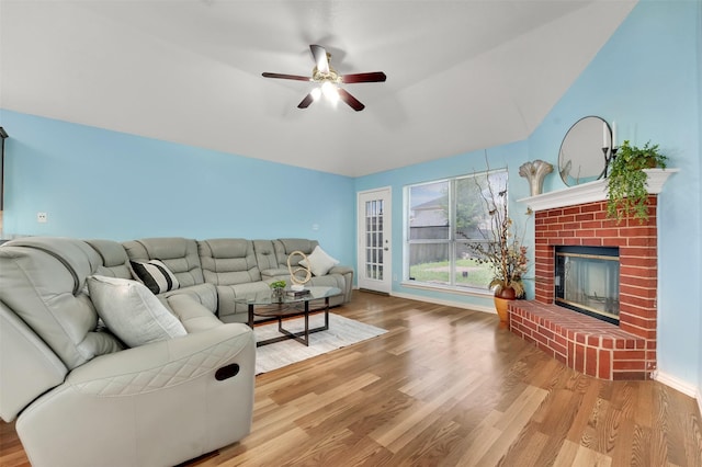 5900 Rising Meadow Dr, Arlington, TX 76018 - living area featuring wood finished floors, ceiling fan, a brick fireplace, and lofted ceiling