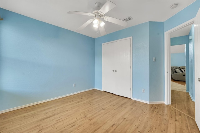 5900 Rising Meadow Dr, Arlington, TX 76018 - unfurnished bedroom featuring wood finished floors and ceiling fan