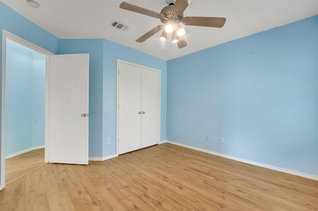 5900 Rising Meadow Dr, Arlington, TX 76018 - unfurnished bedroom featuring wood finished floors, a closet, and a ceiling fan