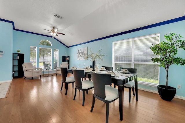 5900 Rising Meadow Dr, Arlington, TX 76018 - dining space featuring vaulted ceiling, crown molding, a ceiling fan, plenty of natural light, and wood finished floors