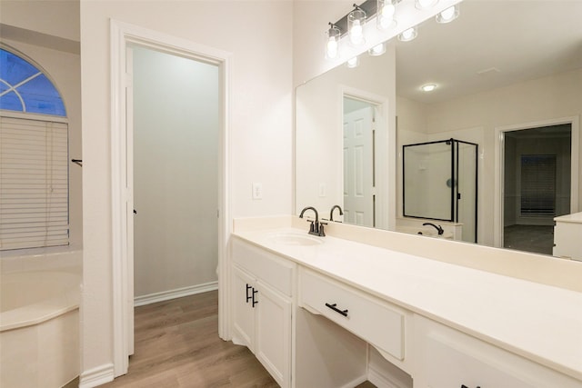 5920 Colby Dr, Plano, TX 75094 - full bathroom with vanity, a bath, a stall shower, and wood finished floors