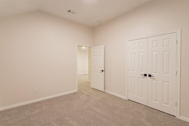 5920 Colby Dr, Plano, TX 75094 - unfurnished bedroom featuring light colored carpet, vaulted ceiling, and a closet