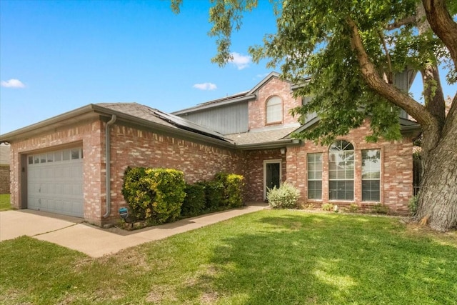 2826 Garden Oaks Pl, Grand Prairie, TX 75052 - traditional home featuring brick siding, roof mounted solar panels, a front yard, and a garage