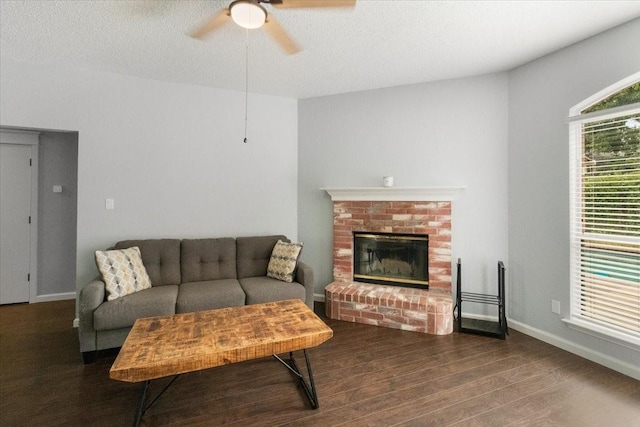 2826 Garden Oaks Pl, Grand Prairie, TX 75052 - living room with ceiling fan, dark wood-type flooring, and a brick fireplace