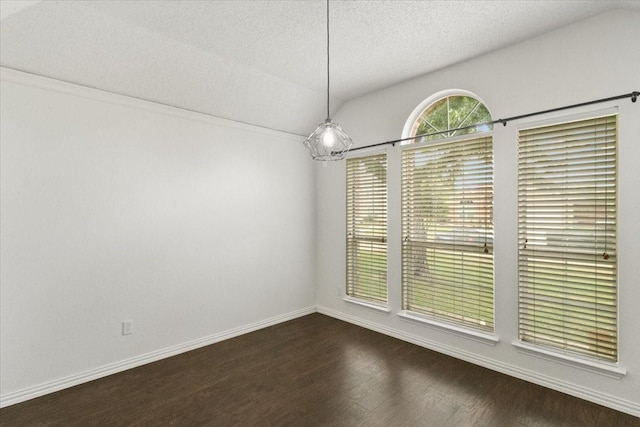 2826 Garden Oaks Pl, Grand Prairie, TX 75052 - unfurnished dining area featuring dark wood-style floors and a textured ceiling