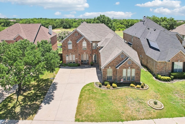 2945 Horseshoe Trl, Frisco, TX 75033 - view of front of property with brick siding, driveway, and a front lawn