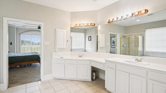2945 Horseshoe Trl, Frisco, TX 75033 - full bath featuring a shower stall, double vanity, tile patterned flooring, and connected bathroom