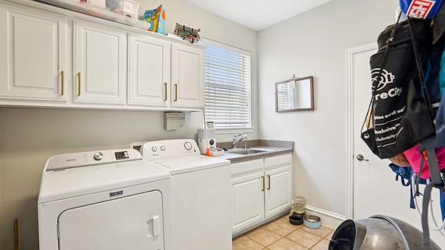 2945 Horseshoe Trl, Frisco, TX 75033 - laundry area featuring washer and clothes dryer, cabinet space, and light tile patterned floors