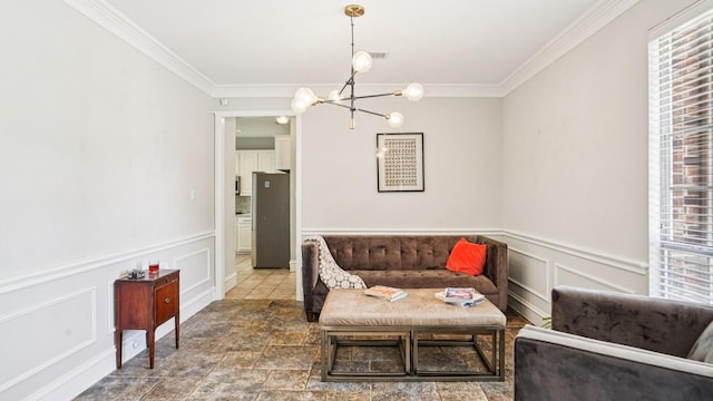 2945 Horseshoe Trl, Frisco, TX 75033 - living room featuring crown molding, a chandelier, plenty of natural light, wainscoting, and a decorative wall