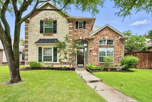 15773 Waterview Dr, Frisco, TX 75035 - view of front facade featuring brick siding and a standing seam roof