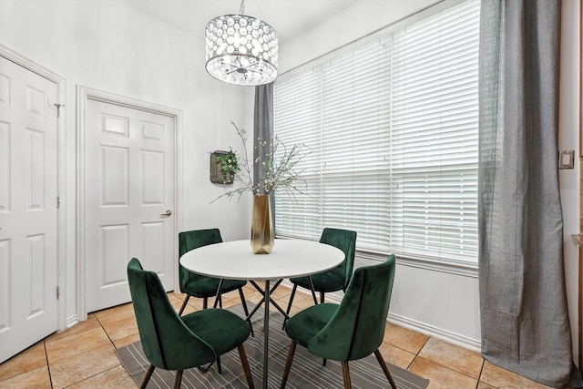 15773 Waterview Dr, Frisco, TX 75035 - dining space featuring light tile patterned flooring, a chandelier, and plenty of natural light