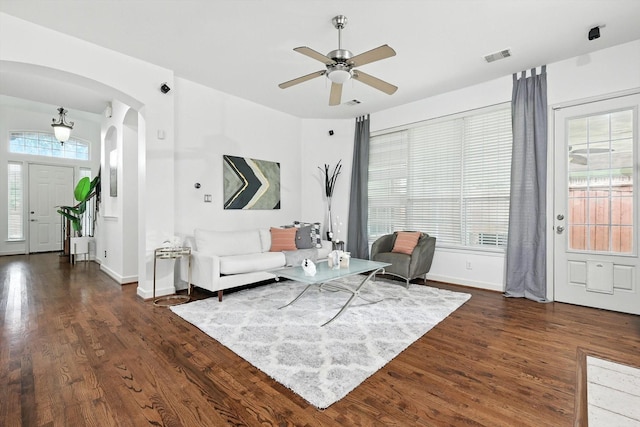 15773 Waterview Dr, Frisco, TX 75035 - living room with arched walkways, dark wood-style flooring, and ceiling fan