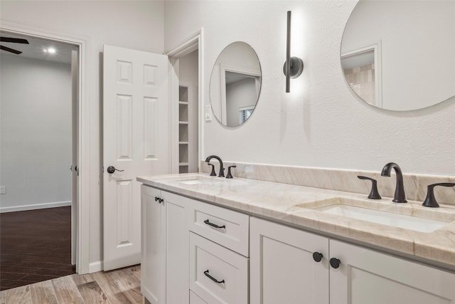 2910 Eagles Nest Ct, Midlothian, TX 76065 - bathroom featuring double vanity, wood finished floors, and ceiling fan