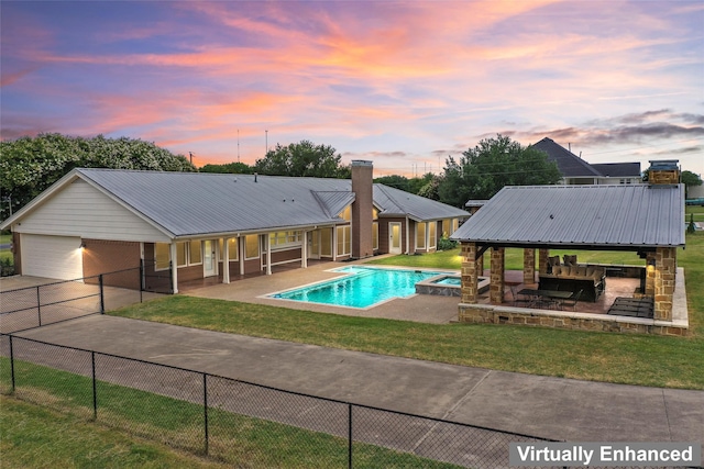 2910 Eagles Nest Ct, Midlothian, TX 76065 - pool at dusk featuring a gazebo, a pool with connected hot tub, and a patio area