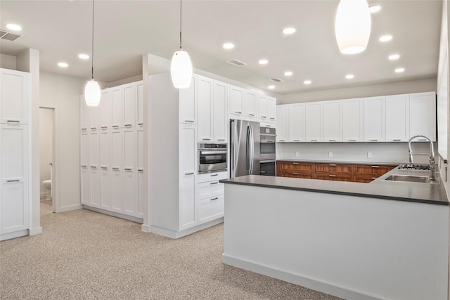 2910 Eagles Nest Ct, Midlothian, TX 76065 - kitchen featuring stainless steel refrigerator, recessed lighting, white cabinetry, a peninsula, and decorative light fixtures