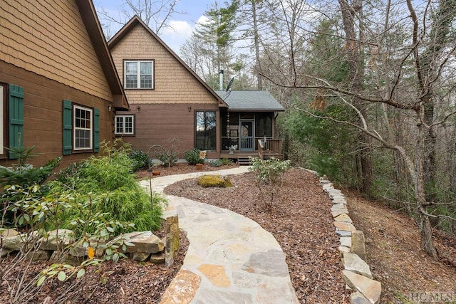 exterior space featuring a sunroom