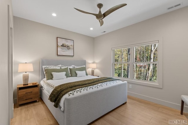 bedroom with light wood-type flooring and ceiling fan