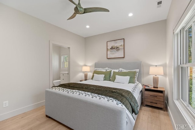 bedroom with ceiling fan, light wood-type flooring, and multiple windows