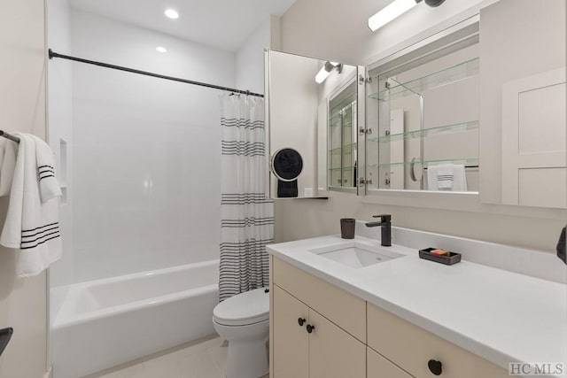 full bathroom featuring tile patterned floors, vanity, toilet, and shower / tub combo