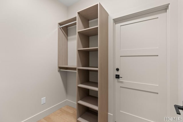 spacious closet featuring light hardwood / wood-style floors