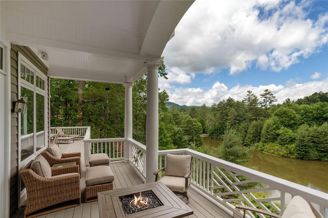 119 Old Still Rd, Sapphire, NC 28774 - wooden terrace with an outdoor fire pit, a view of trees, and a water view