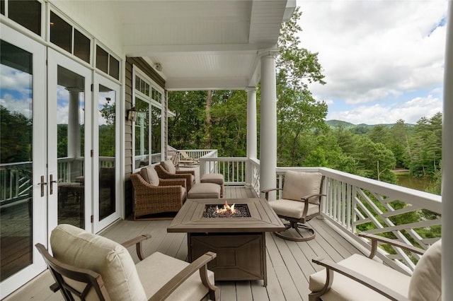 119 Old Still Rd, Sapphire, NC 28774 - wooden terrace with a fire pit, french doors, and a view of trees