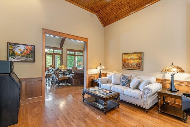 119 Old Still Rd, Sapphire, NC 28774 - living area featuring wooden ceiling, a wainscoted wall, light wood-type flooring, a desk, and high vaulted ceiling