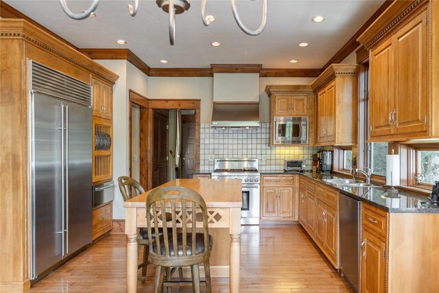 119 Old Still Rd, Sapphire, NC 28774 - kitchen with built in appliances, ornamental molding, light wood finished floors, tasteful backsplash, and recessed lighting