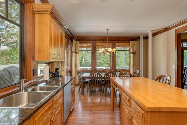 119 Old Still Rd, Sapphire, NC 28774 - kitchen with stainless steel dishwasher, wooden counters, light wood finished floors, pendant lighting, and brown cabinets