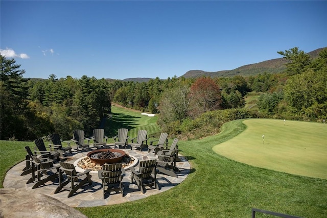 119 Old Still Rd, Sapphire, NC 28774 - view of patio / terrace with an outdoor fire pit, a putting area, a forest view, golf course view, and a mountain view