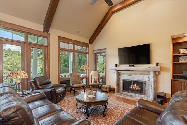 119 Old Still Rd, Sapphire, NC 28774 - living room with beamed ceiling, wood finished floors, high vaulted ceiling, a premium fireplace, and ceiling fan