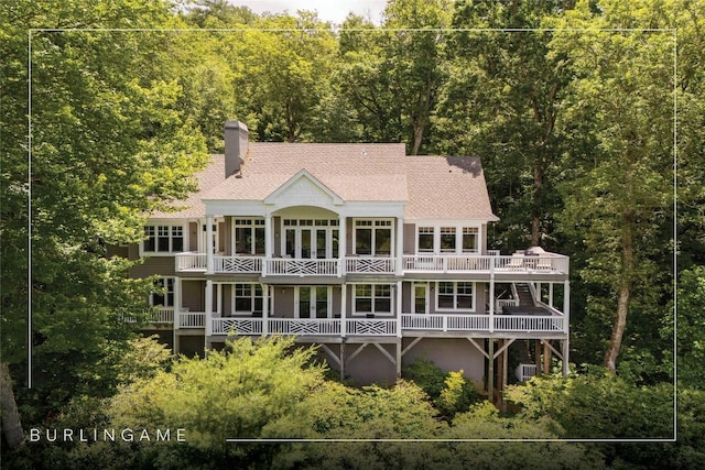 119 Old Still Rd, Sapphire, NC 28774 - rear view of property with a chimney, a view of trees, roof with shingles, a balcony, and a deck